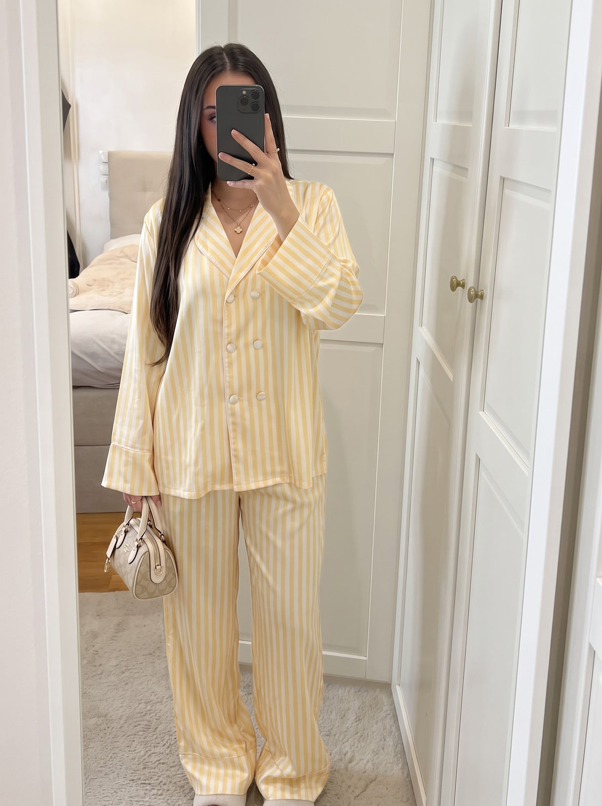Woman wearing the Yellow Striped Long Sleeve Silky Pajama Set by Morning Lace