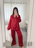 Woman wearing the Burgundy Star Print Silky Pajama Set by Morning Lace