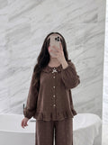Woman wearing the Brown Polka Dot Pajama Set by Morning Lace