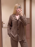 Woman wearing the Brown Pinstripe Pajama Set by Morning Lace