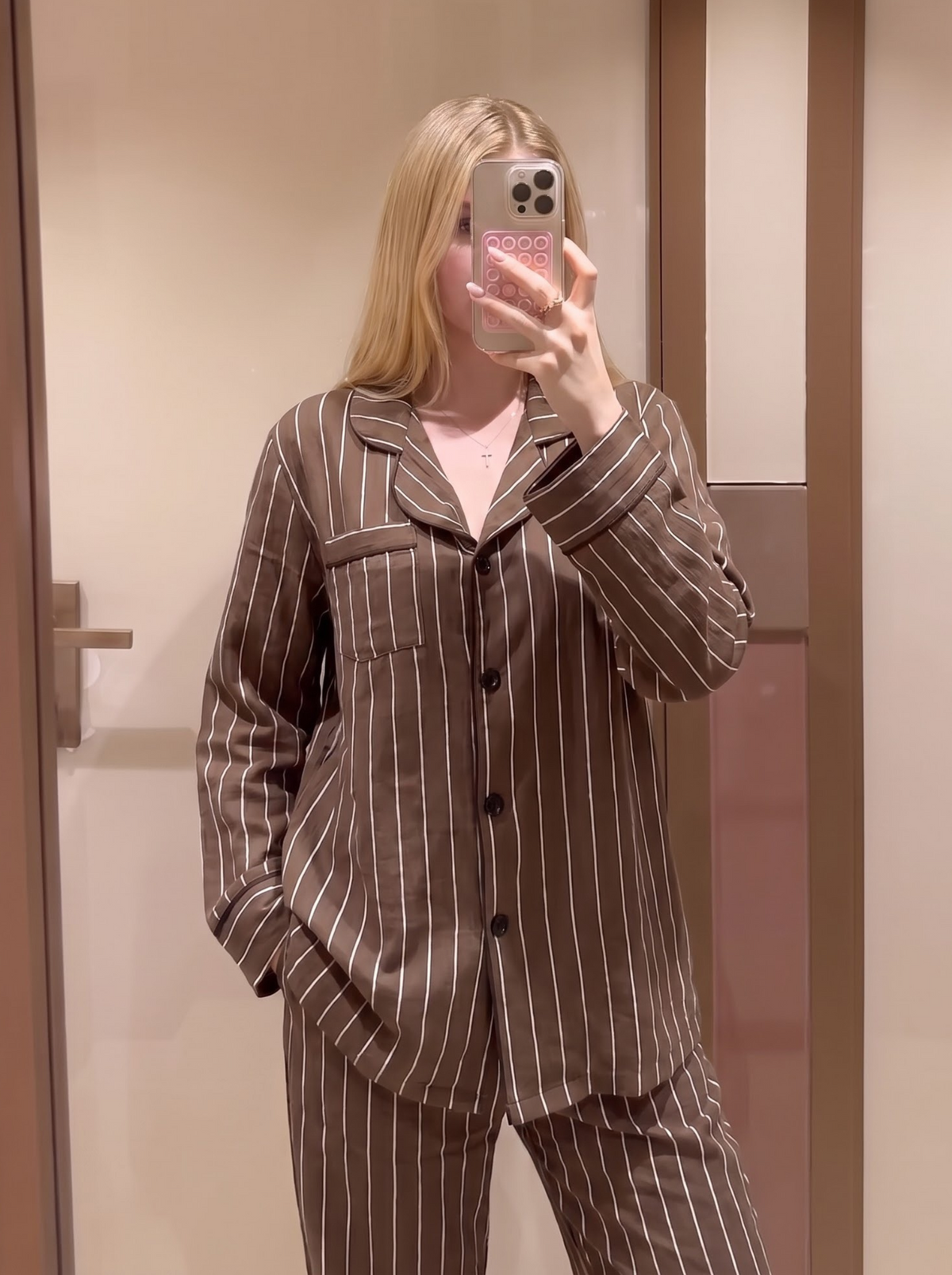 Woman wearing the Brown Pinstripe Pajama Set by Morning Lace