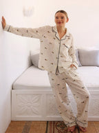 Woman wearing the Ivory Dachshund Print Pajama Set by Morning Lace